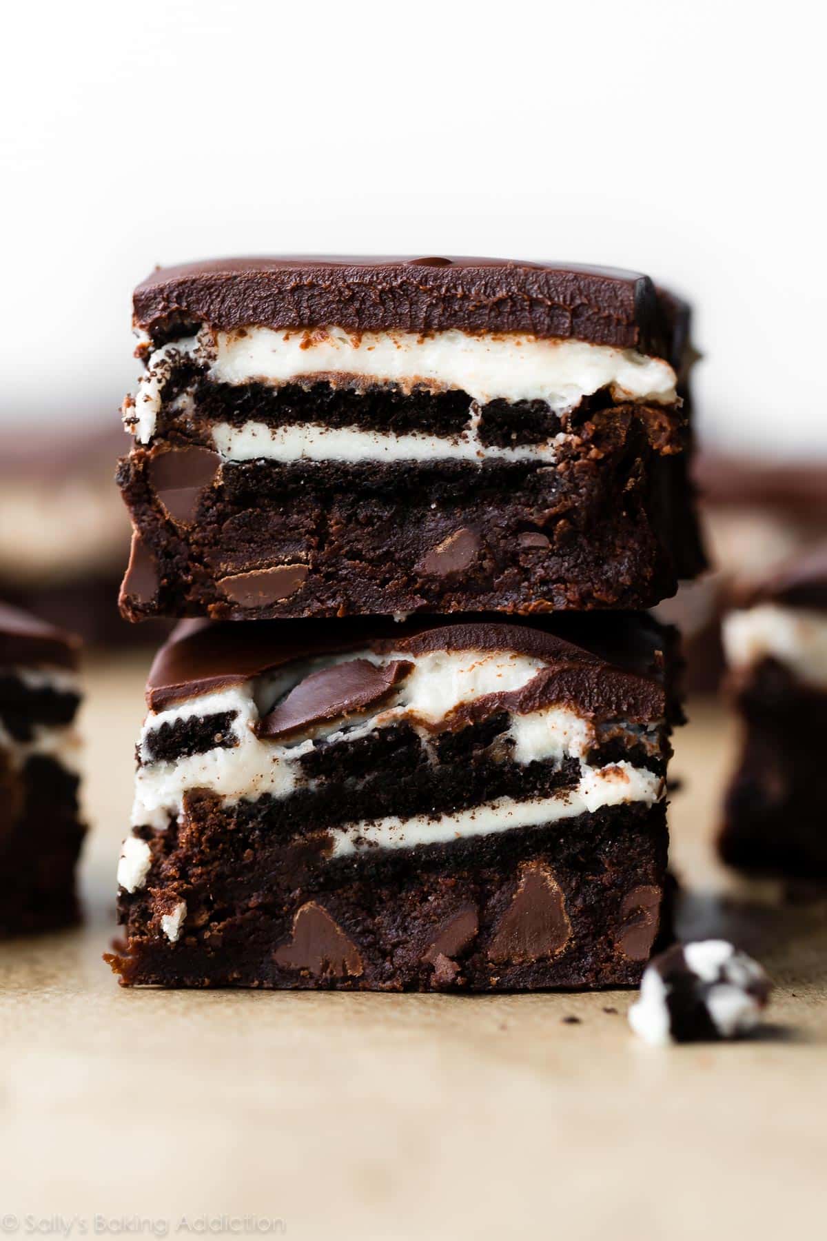 A stack of cookies and oreo cream brownies