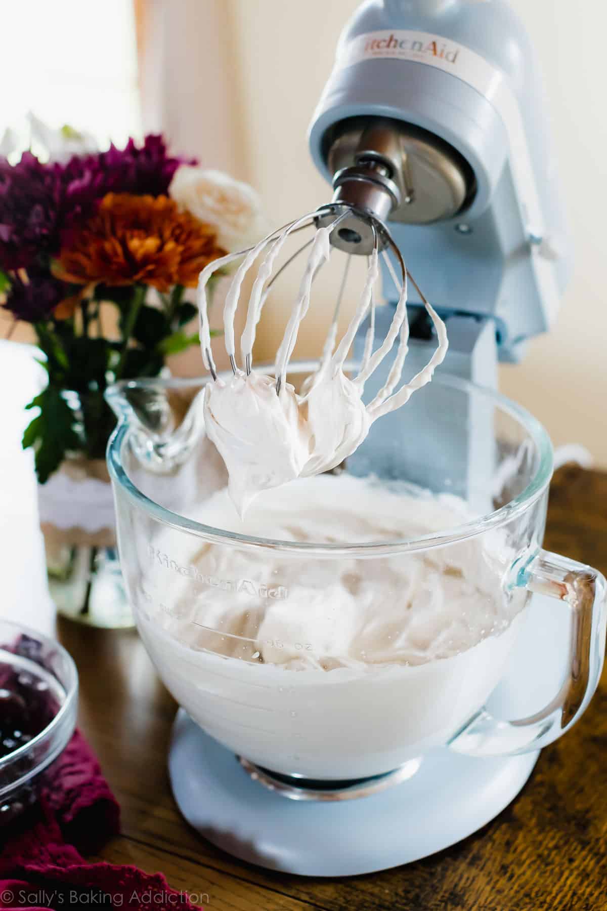 Homemade Whipped Cream in a glass stand mixer bowl