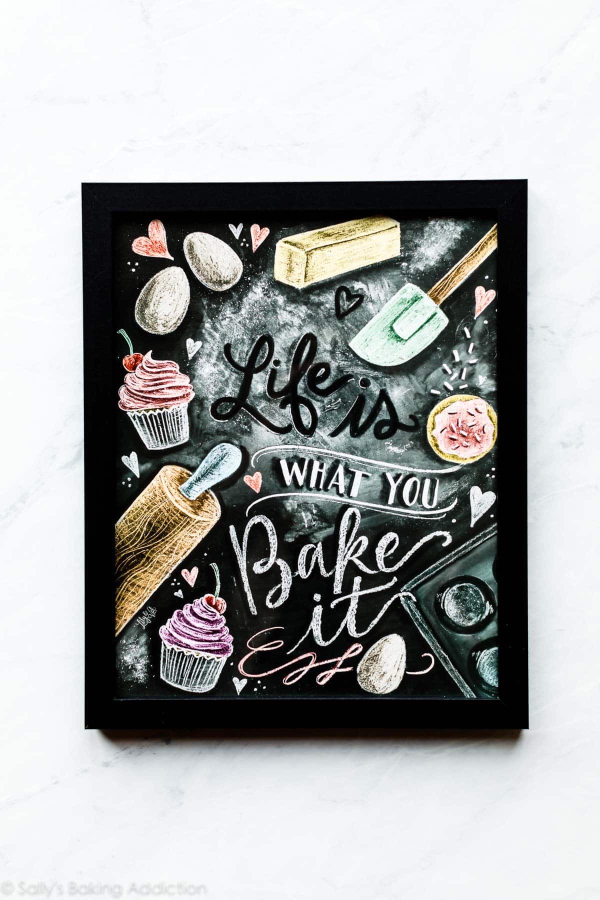 Life is what you bake it art print in a black frame
