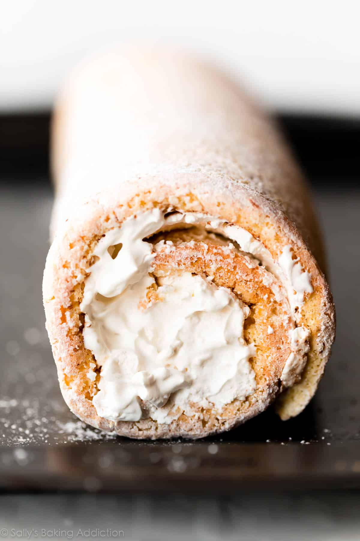Champagne cake roll on a baking sheet