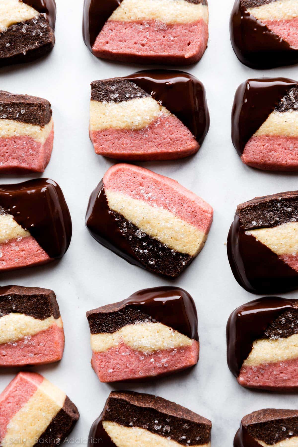 3 layer neapolitan cookies with corners dipped in chocolate