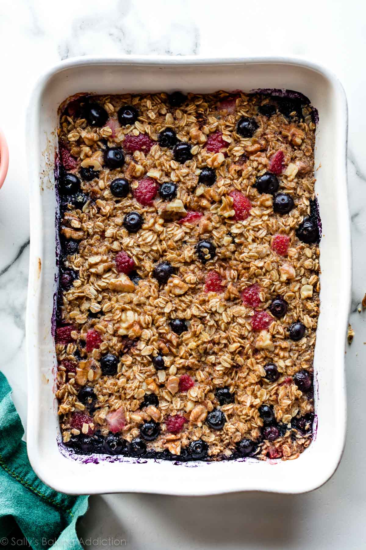 overhead image of baked oatmeal in white 9x13 baking dish