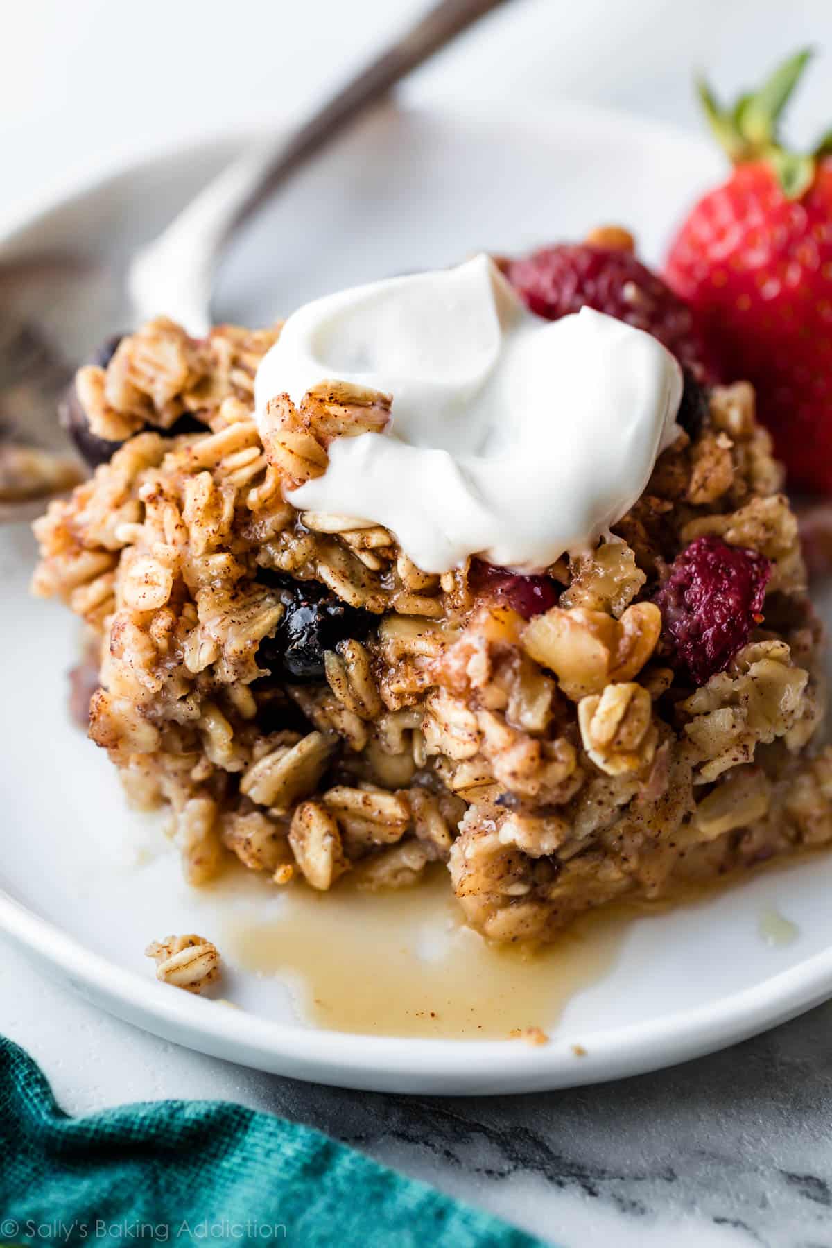 pice of baked oatmeal on a white plate with toppings