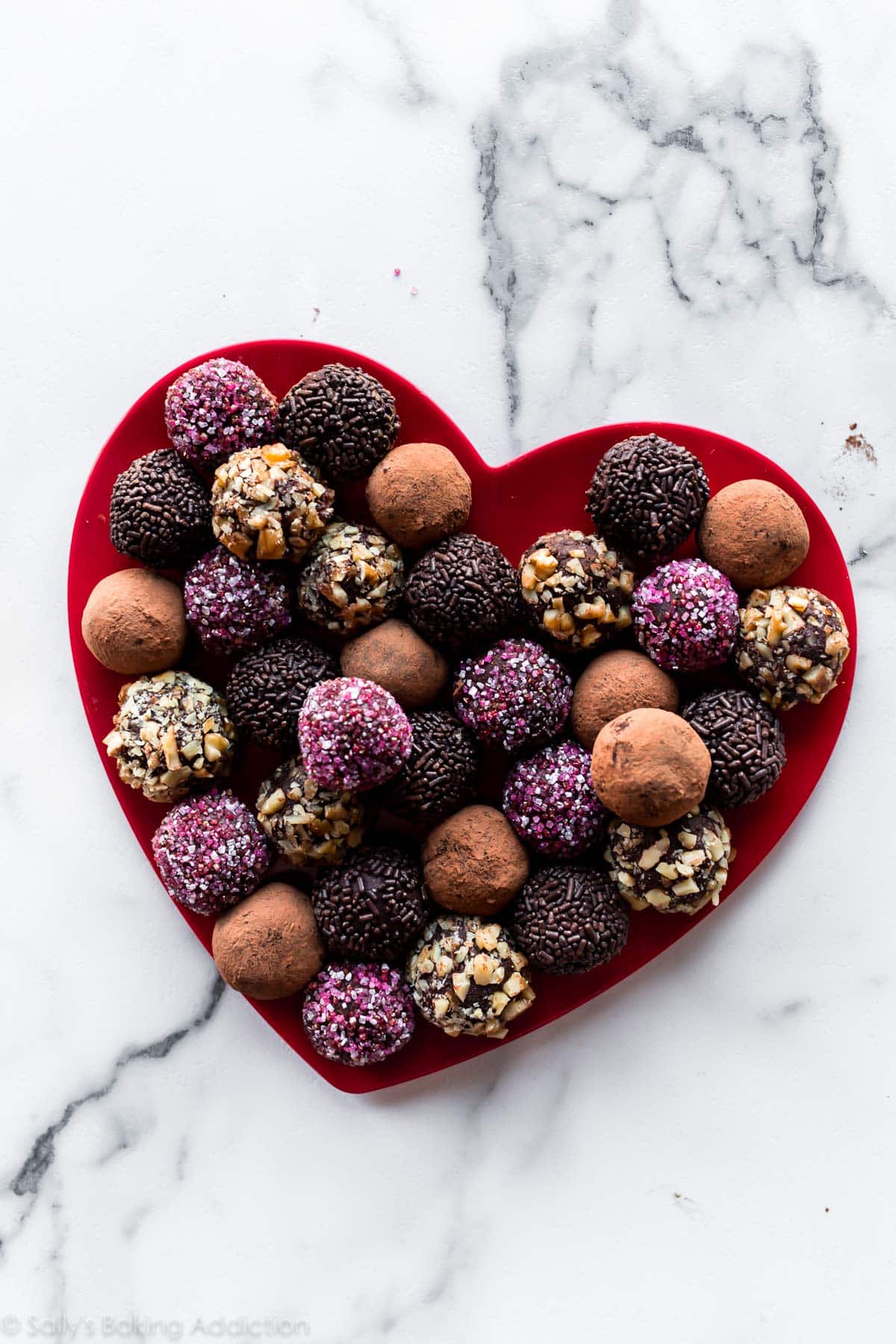 Homemade chocolate truffles on Valentine's Day heart plate