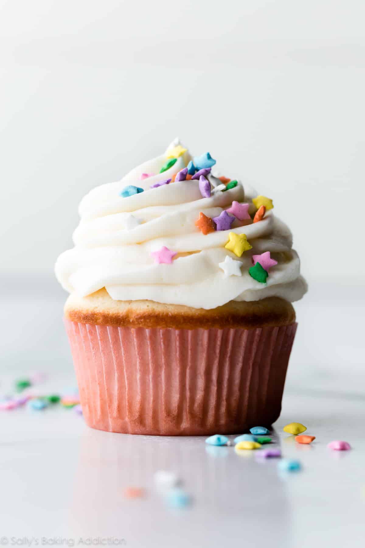 Vanilla cupcake with vanilla frosting and star sprinkles