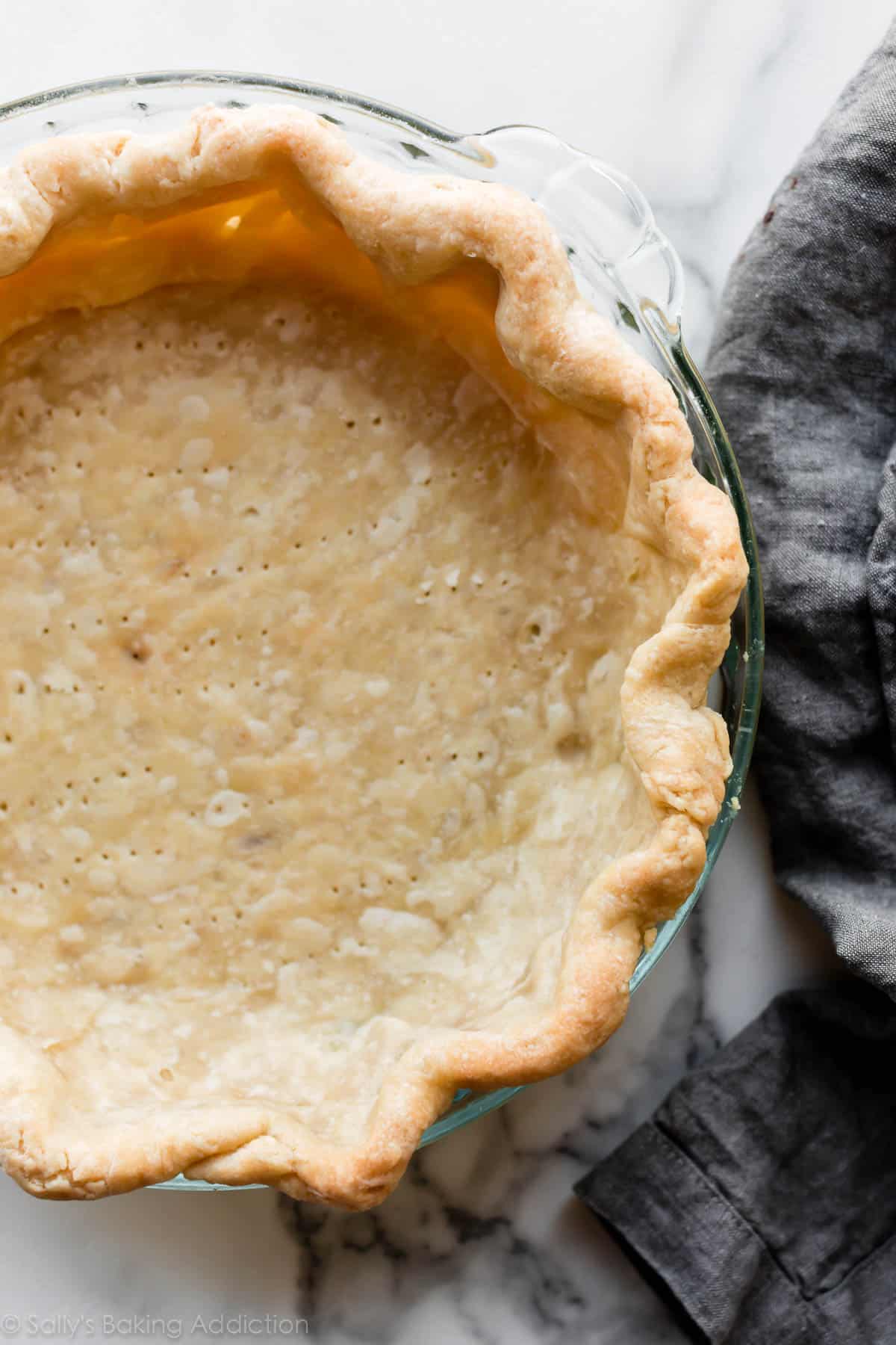 Blind baked pie crust in glass pie dish
