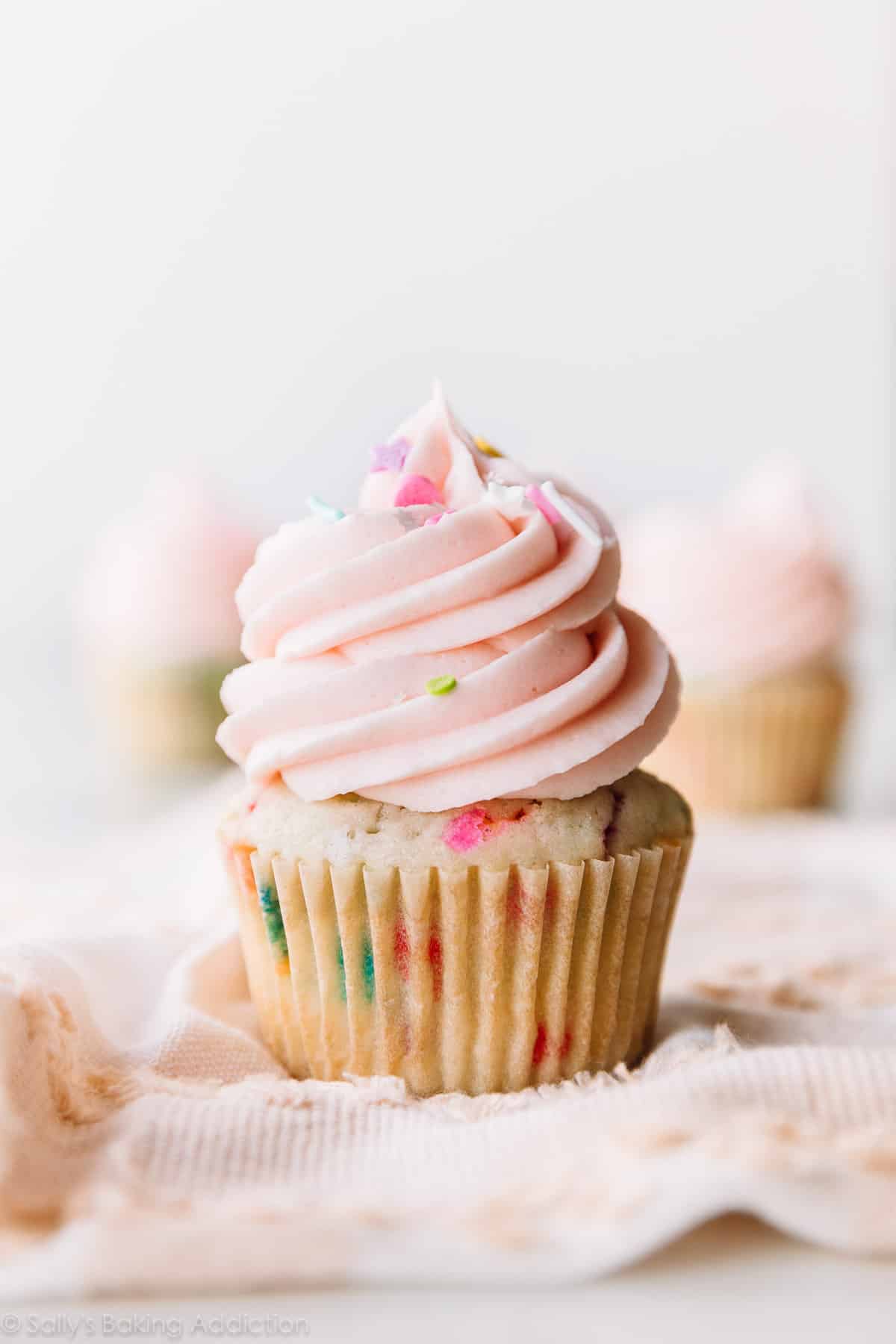 Sprinkle cupcake with pink buttercream frosting