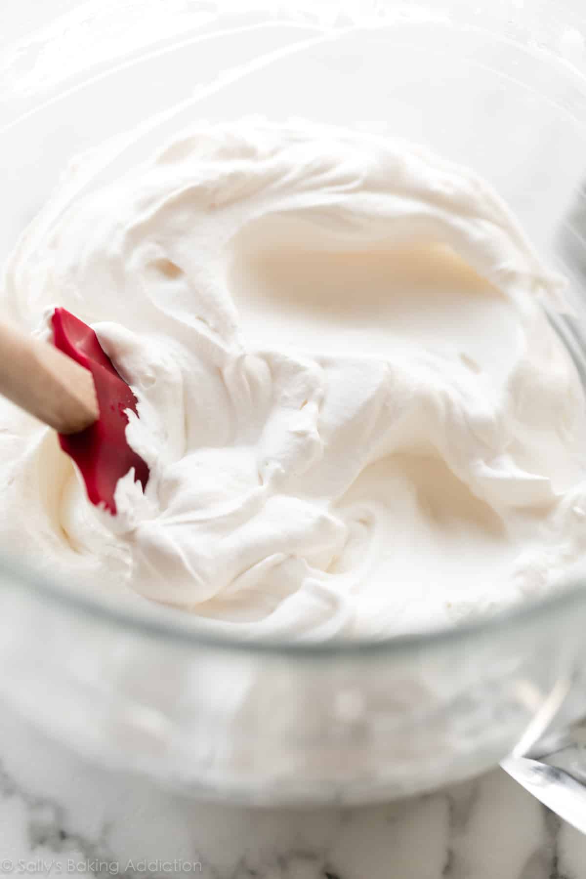 Whipped cream in glass bowl