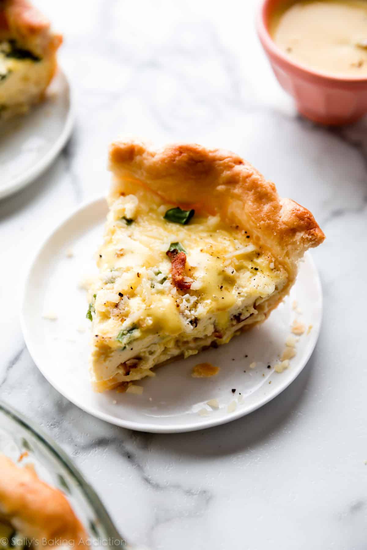 Slice of quiche on a white plate