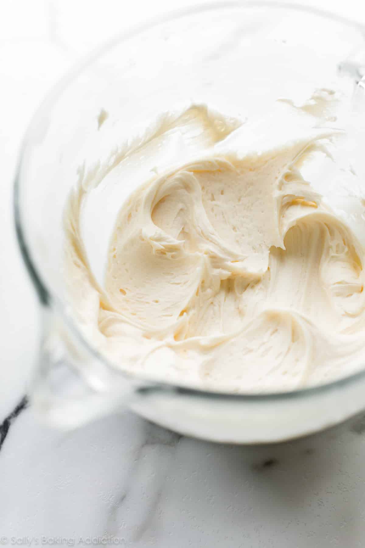 glass bowl of cream cheese buttercream frosting