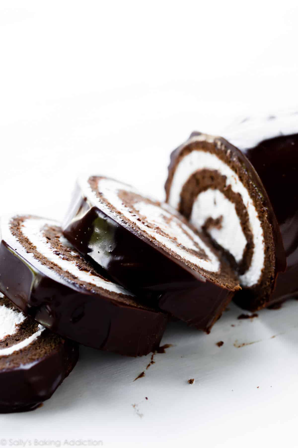 Chocolate Swiss roll cake cut into slices