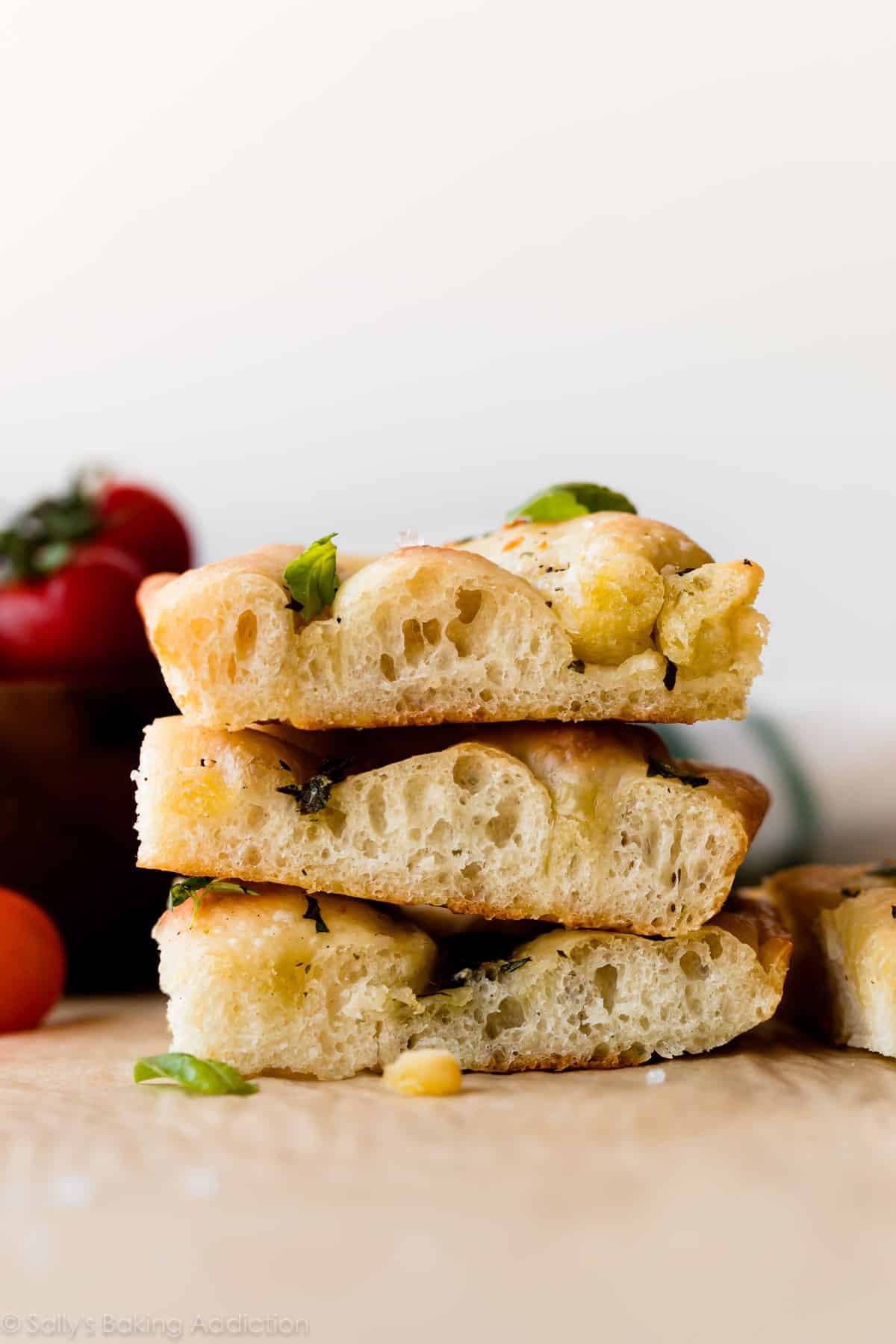 stack of garlic rosemary herb focaccia bread with basil