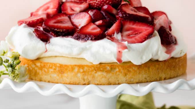 Strawberry shortcake cake on white cake stand