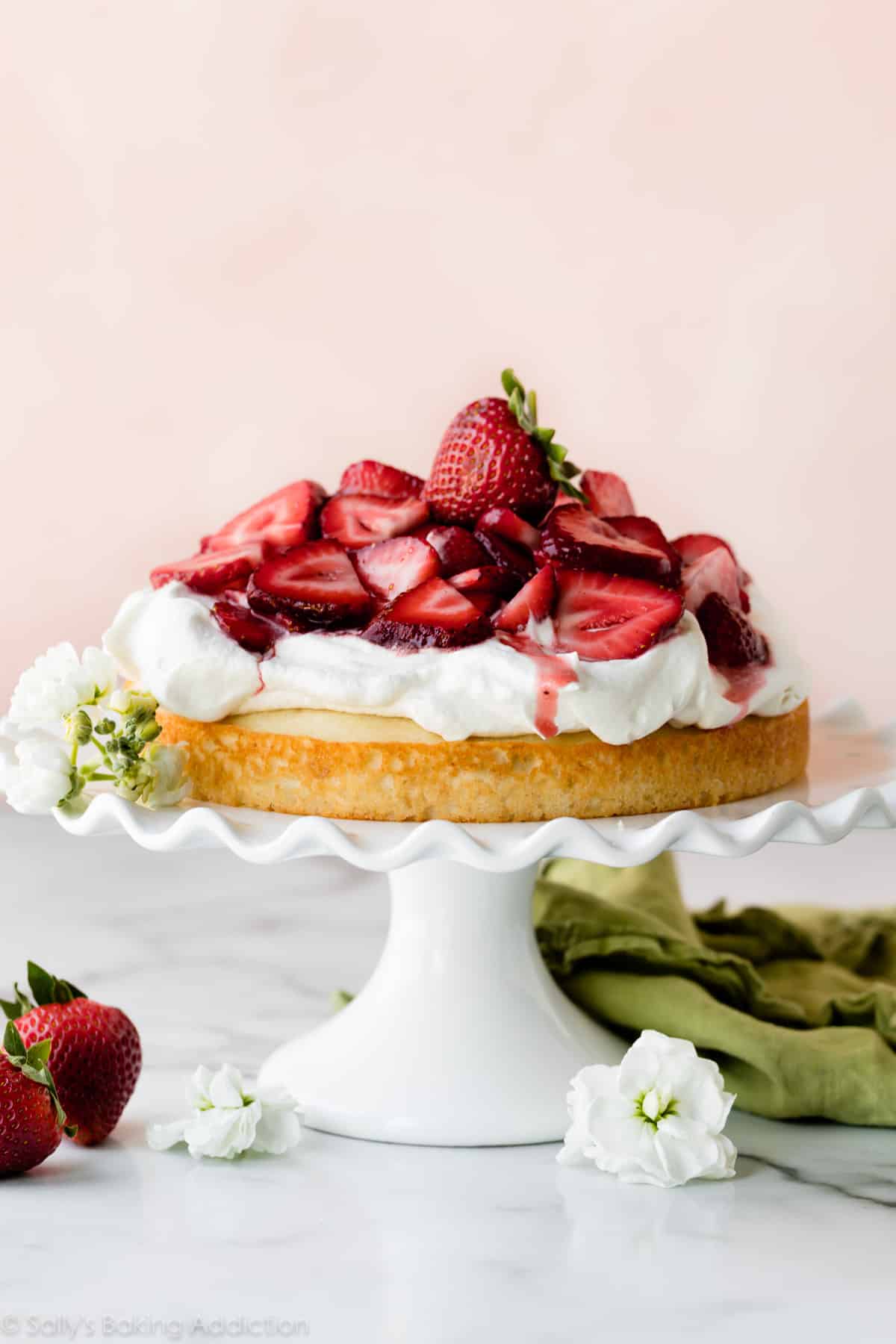 Strawberry shortcake cake on white cake stand