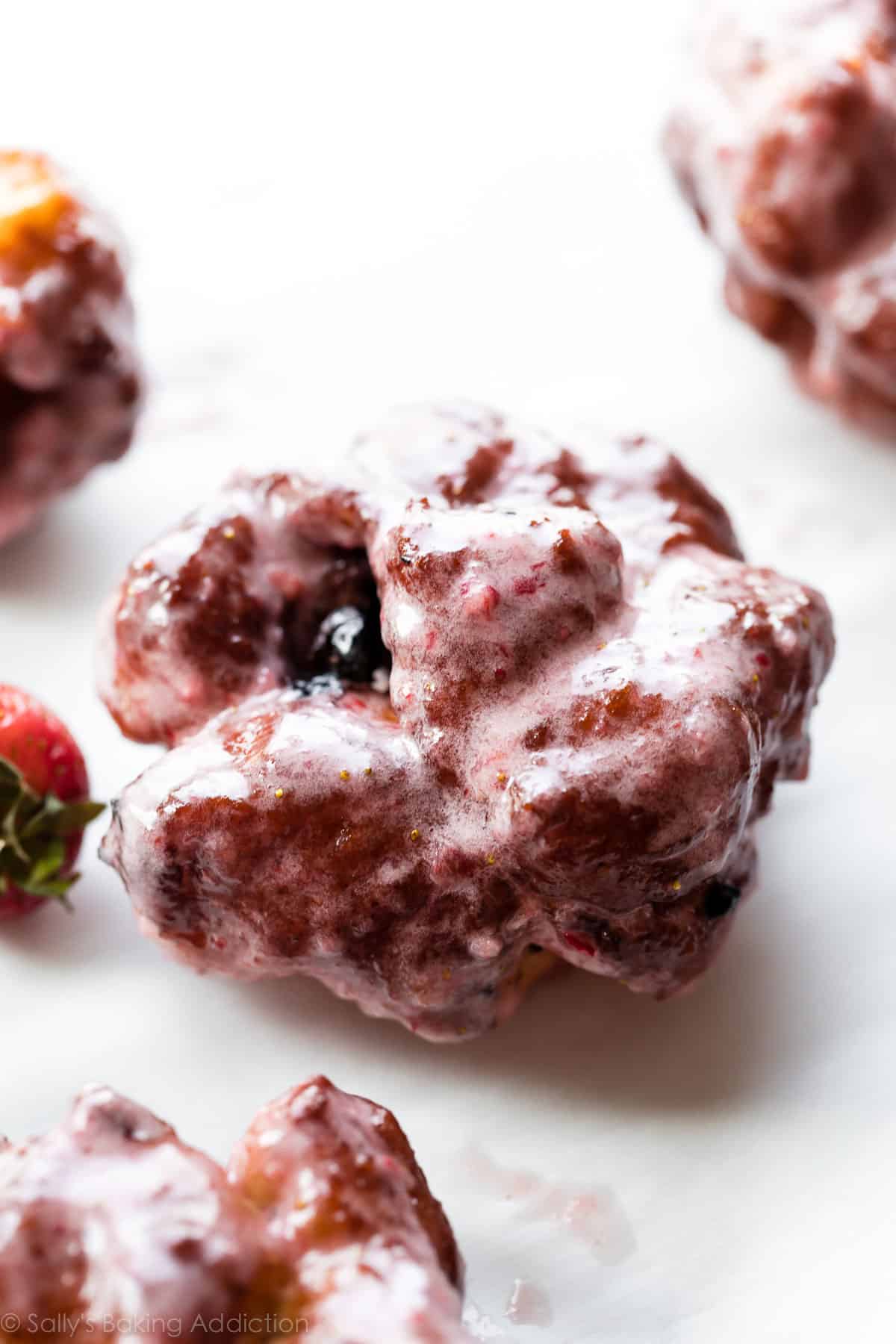 Blueberry fritters with strawberry glaze