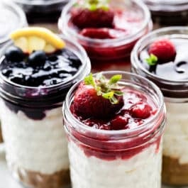 individual no bake cheesecake jars with assorted toppings