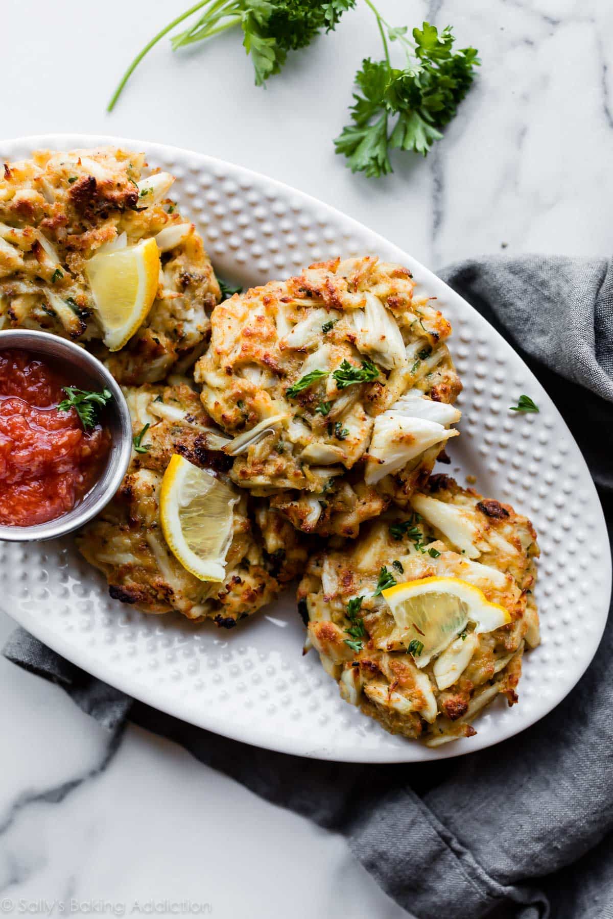 Maryland crab cakes on a white platter