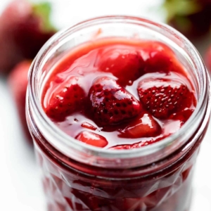 strawberry sauce dessert topping in glass jar