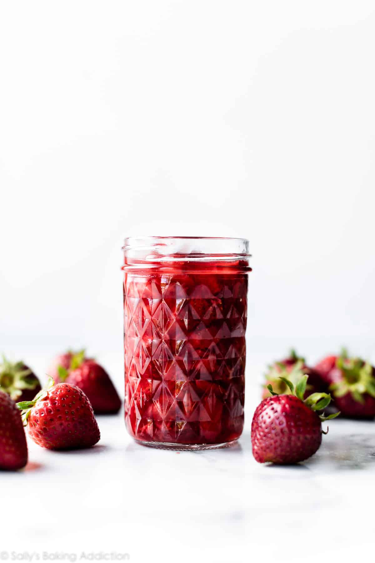 strawberry sauce dessert topping in glass jar