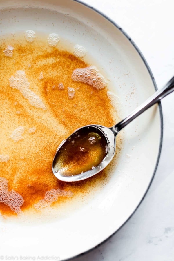 brown butter in a pan with a silver spoon