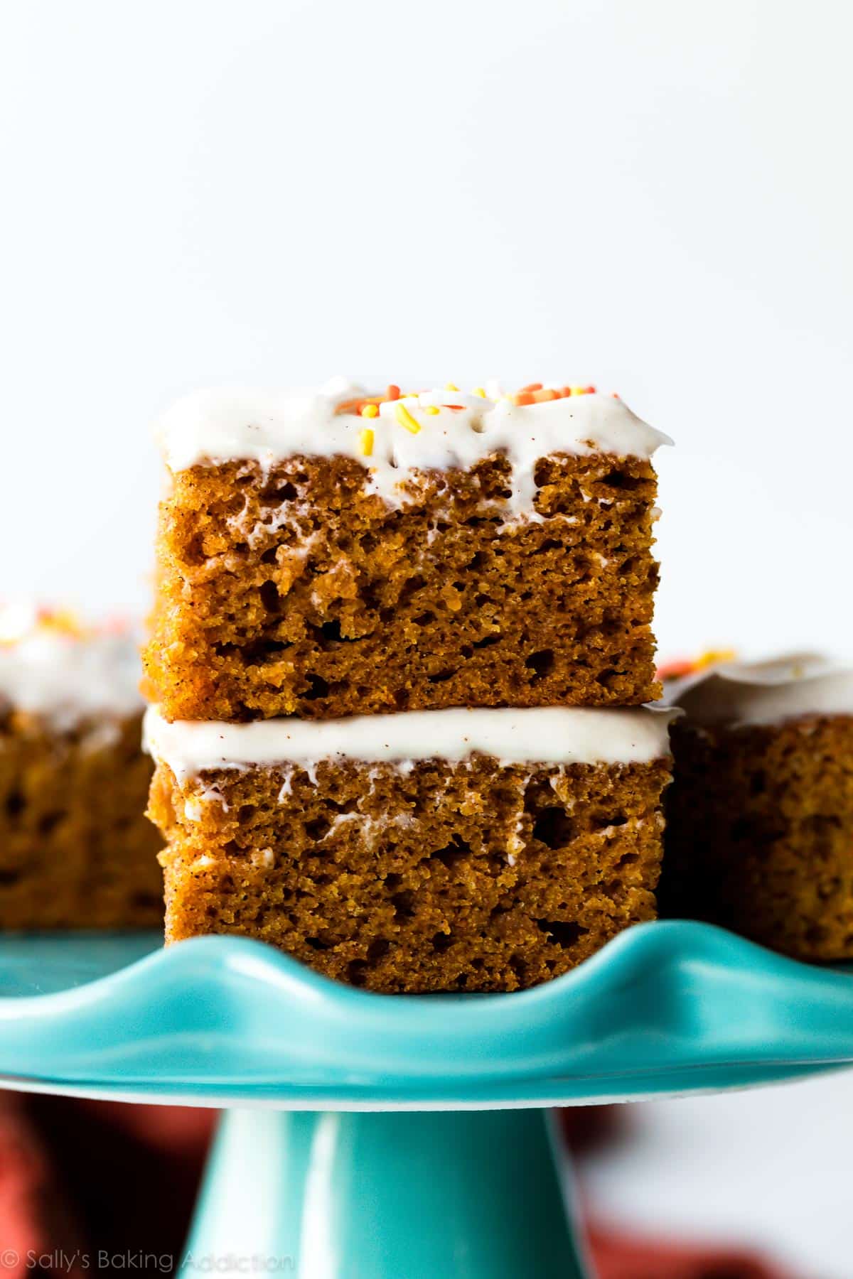 stack of pumpkin bars on blue cake stand