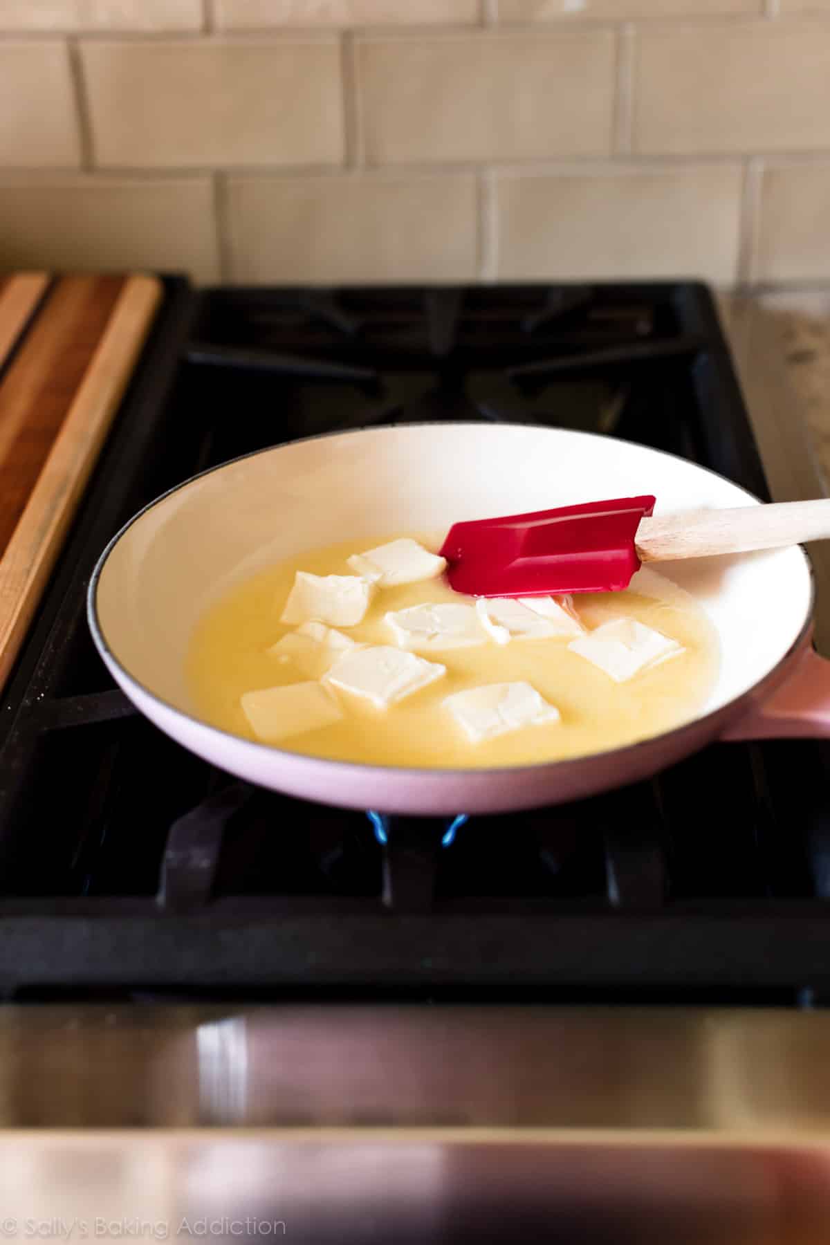 softened butter in pan on stove