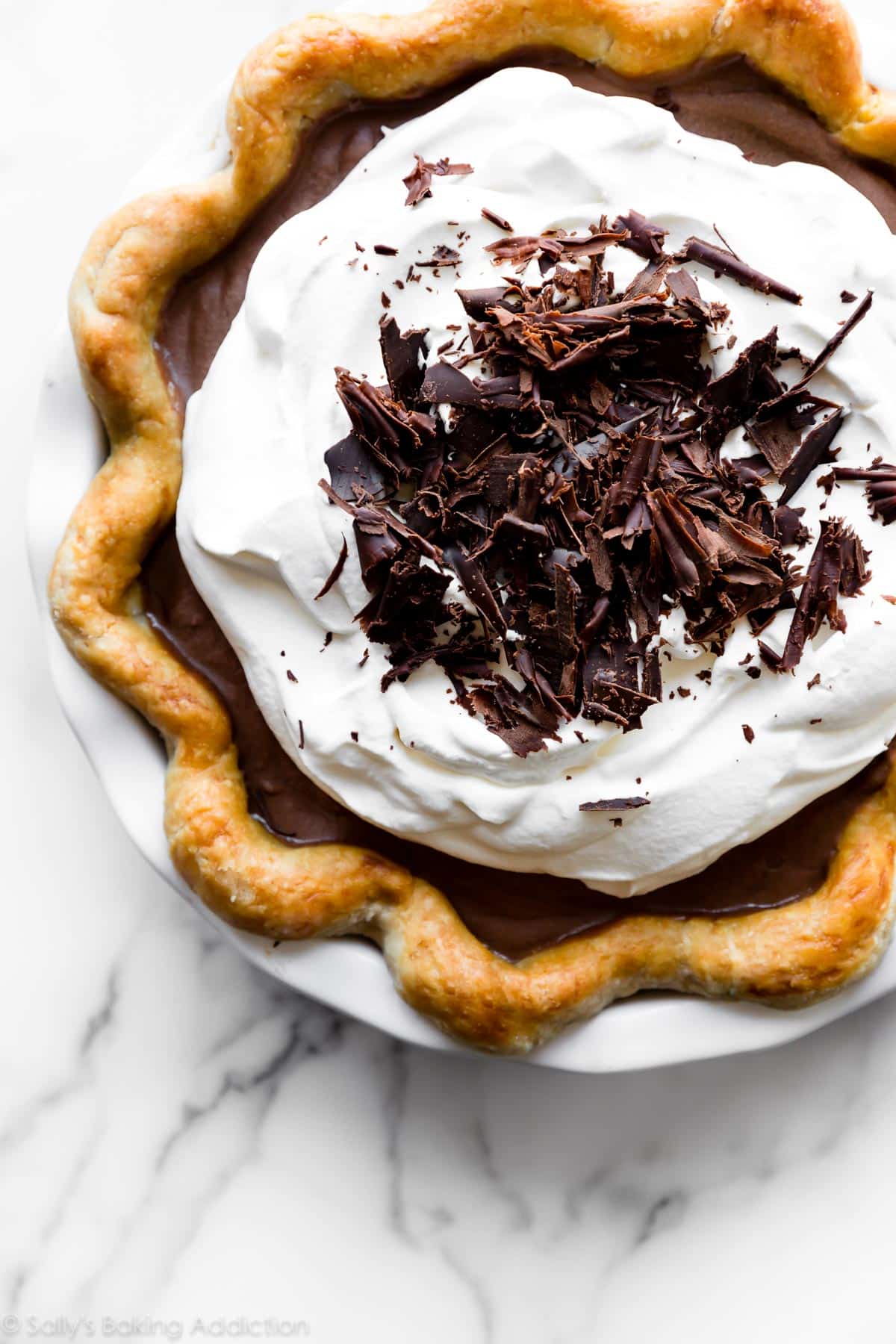 french silk pie with whipped cream and chocolate shavings
