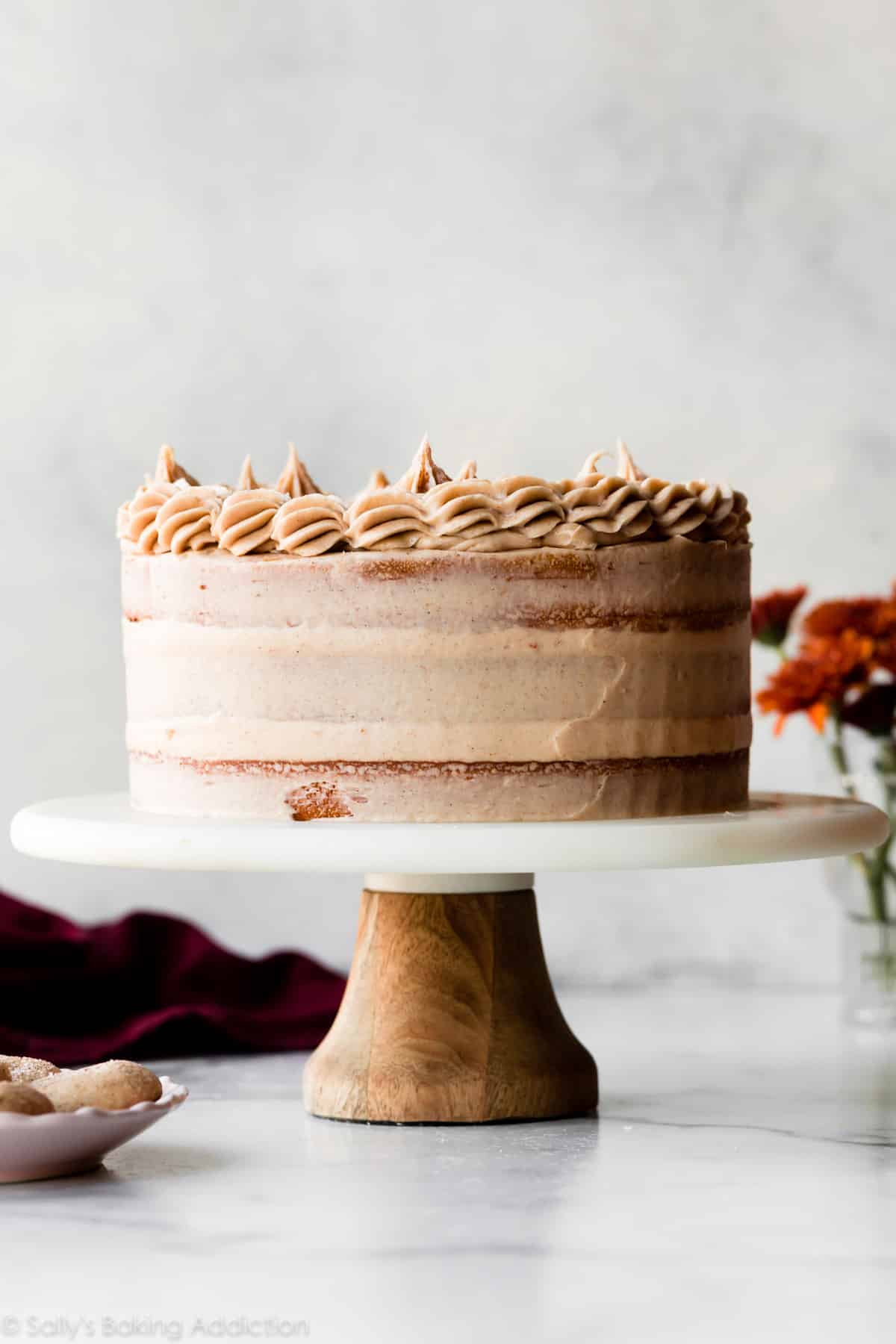 snickerdoodle cake on a marble cake stand