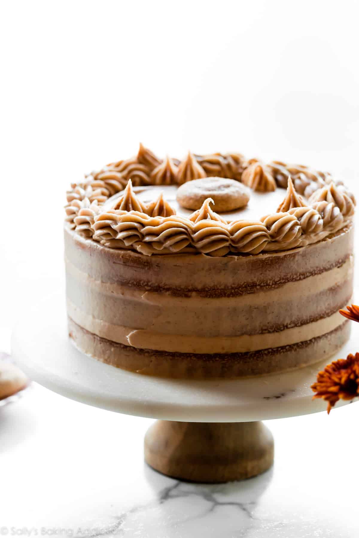 snickerdoodle layer cake on a marble cake stand