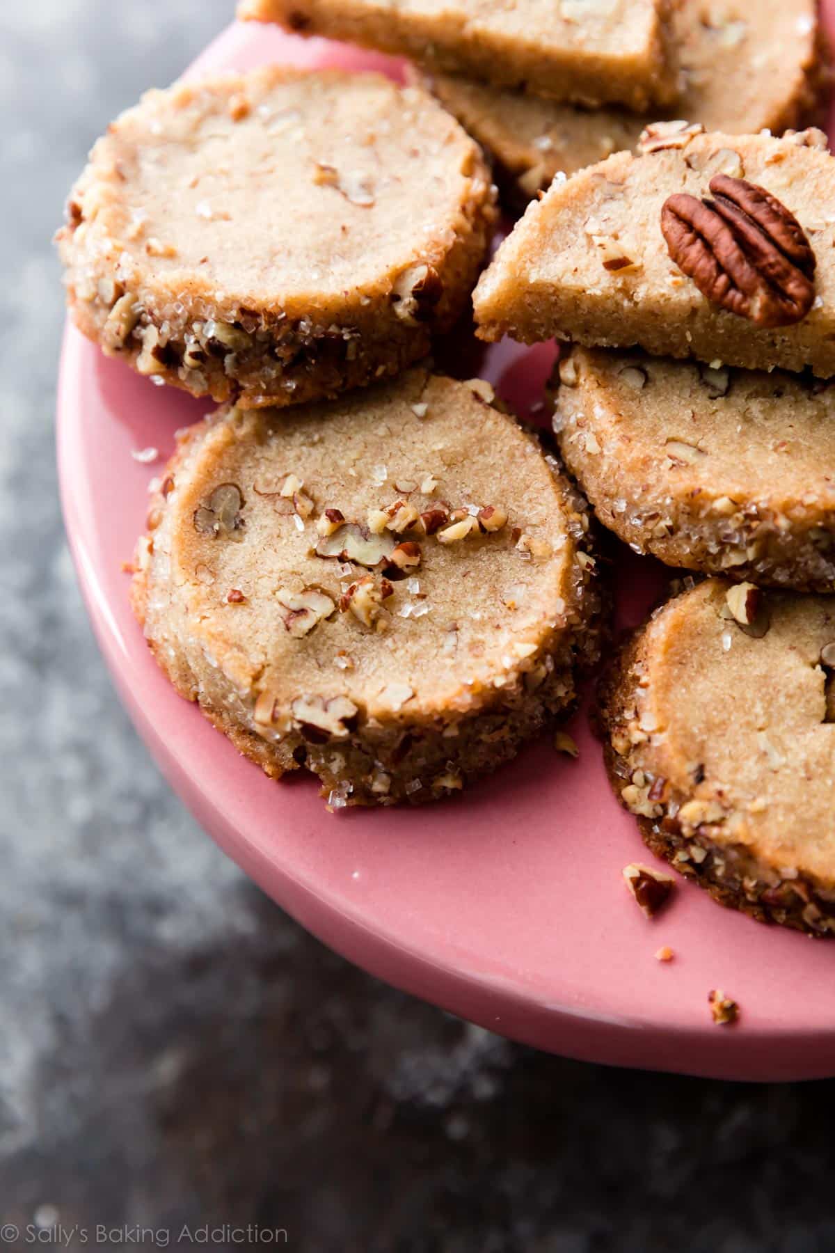 pecan shortbread cookies on a pink cake stand