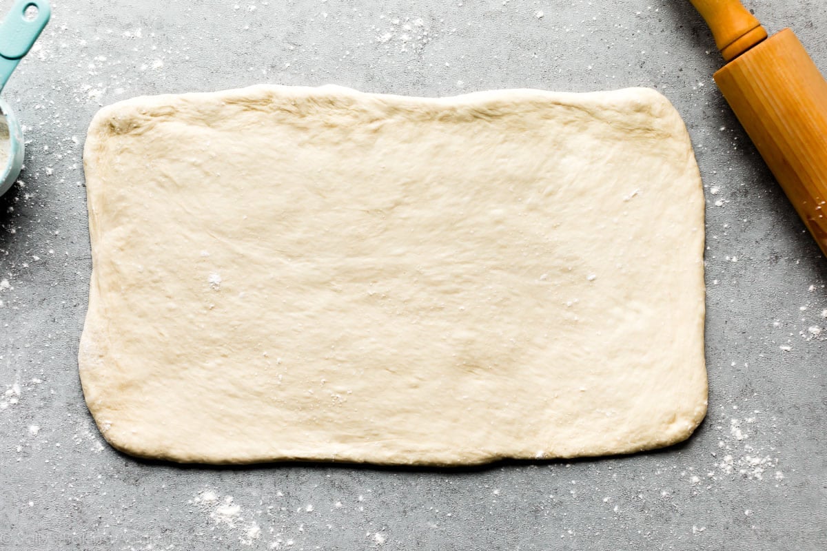 white sandwich bread dough rolled into a rectangle