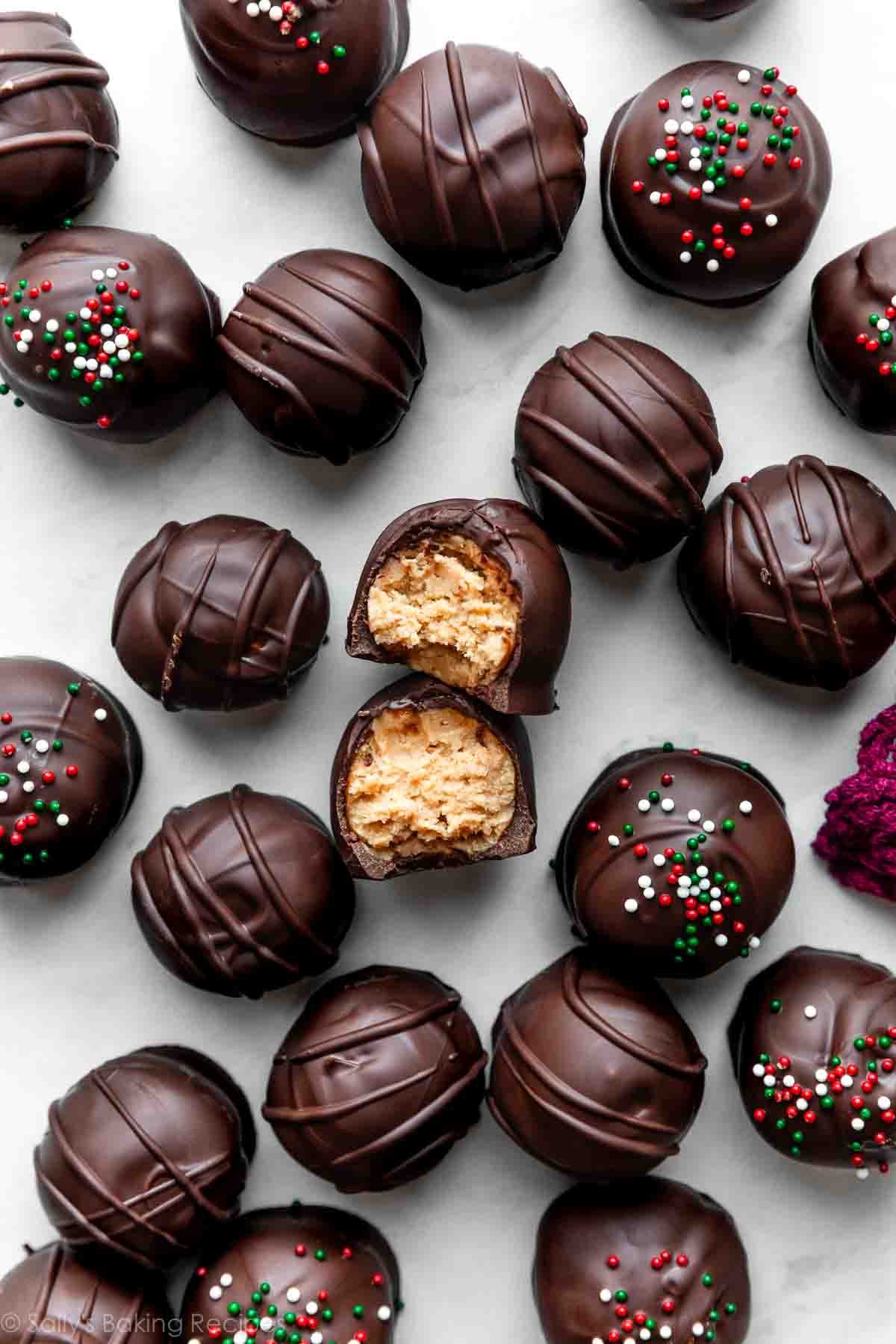 overhead photo of chocolate-covered peanut butter balls with sprinkles on top.
