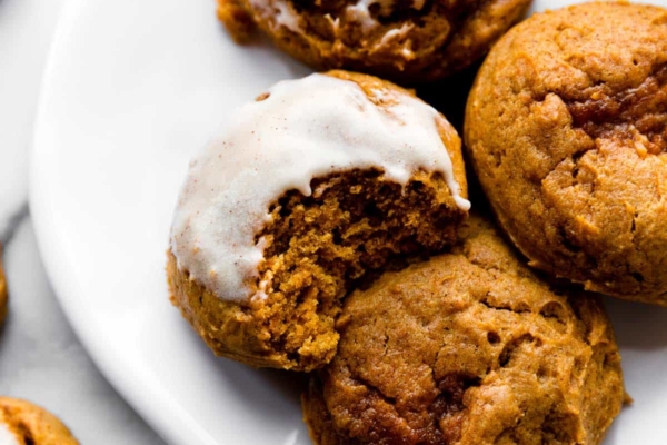 pumpkin cookies with icing on top