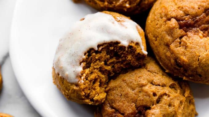 pumpkin cookies with icing on top