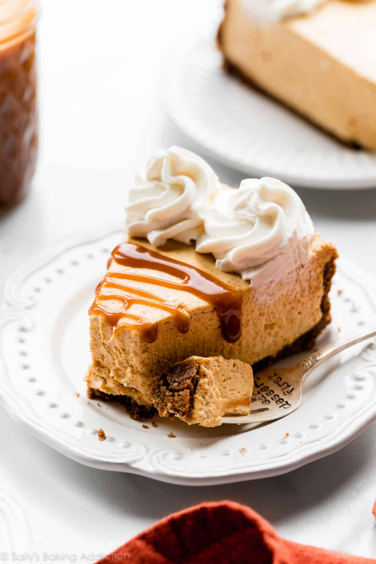 slice of no bake pumpkin cheesecake with a gingersnap crust