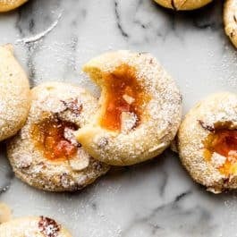 cream cheese thumbprint cookies with apricot jam in the center