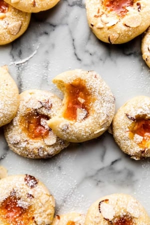 cream cheese thumbprint cookies with apricot jam in the center