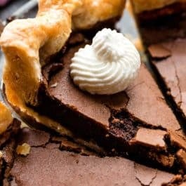 slice of chocolate chess pie with whipped cream on top