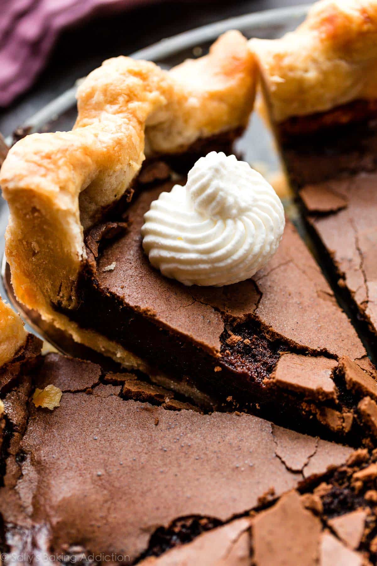 slice of chocolate chess pie with whipped cream on top