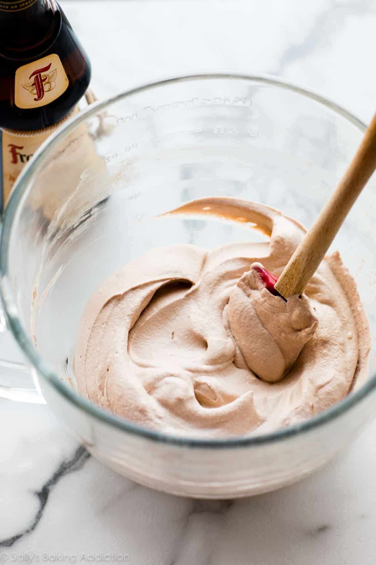 cocoa hazelnut whipped cream with frangelico bottle in background