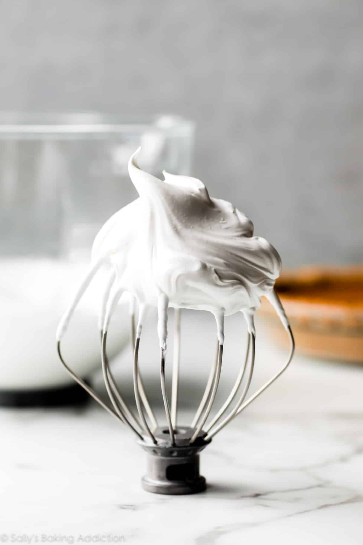 meringue sitting on a whisk attachment