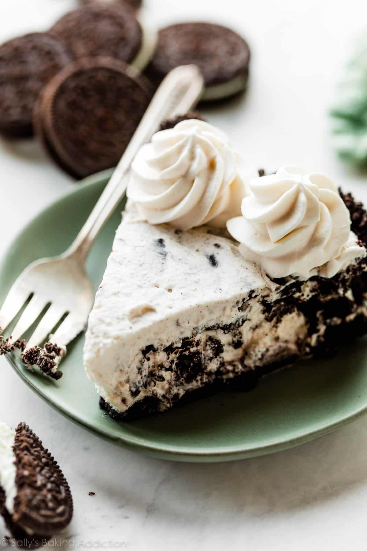slice of cookies and cream Oreo pie on green plate