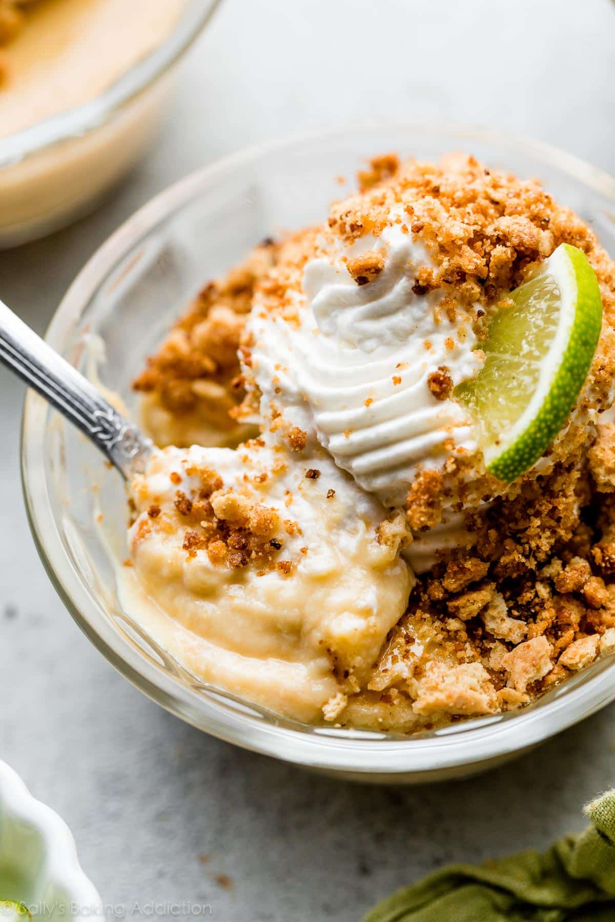 key lime pie custard with whipped cream and graham cracker crumbles