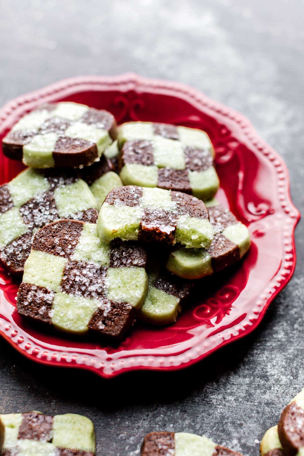 mint chocolate checkerboard cookies on a red plate