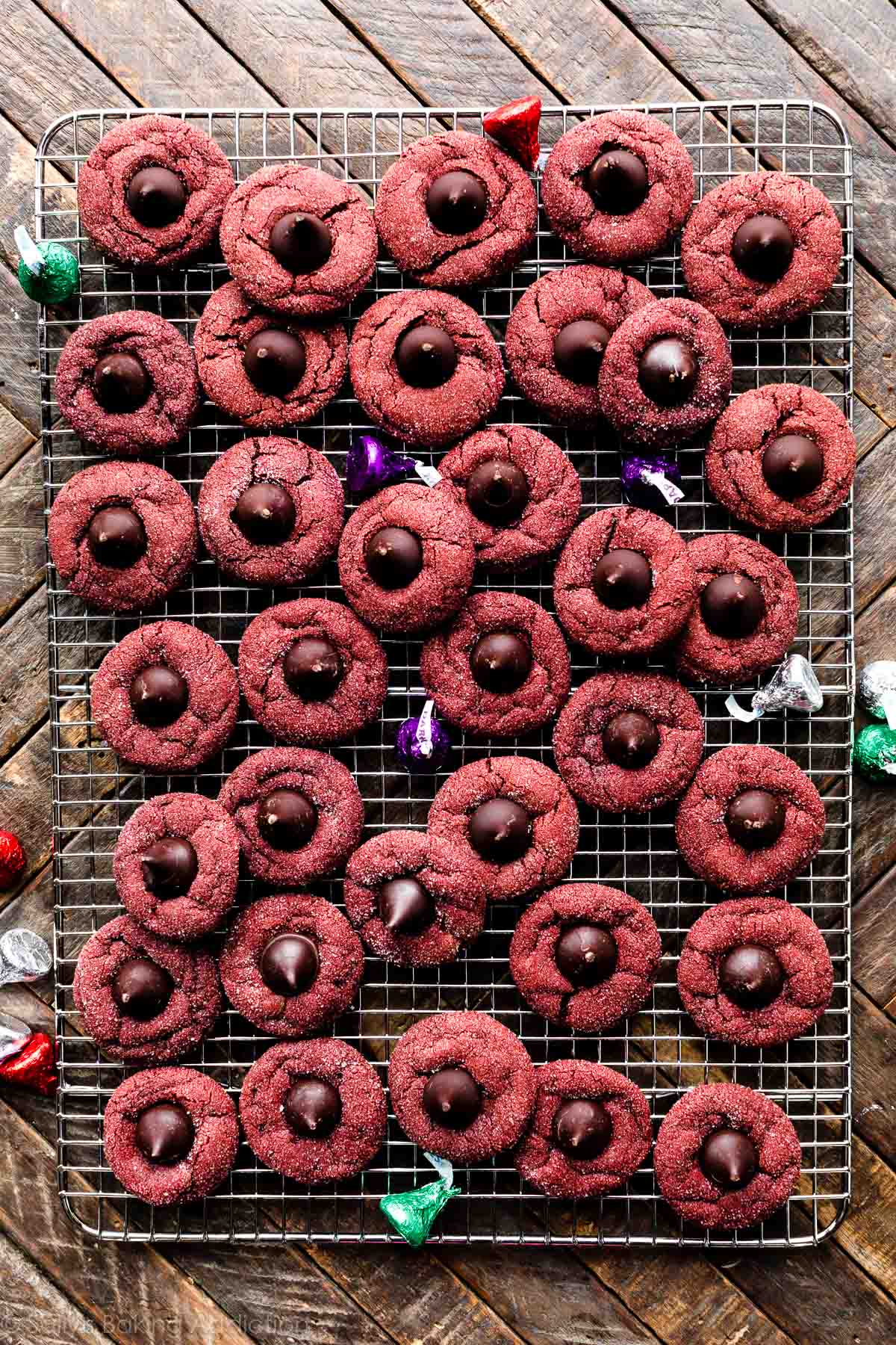 red velvet kiss cookies on cooling rack