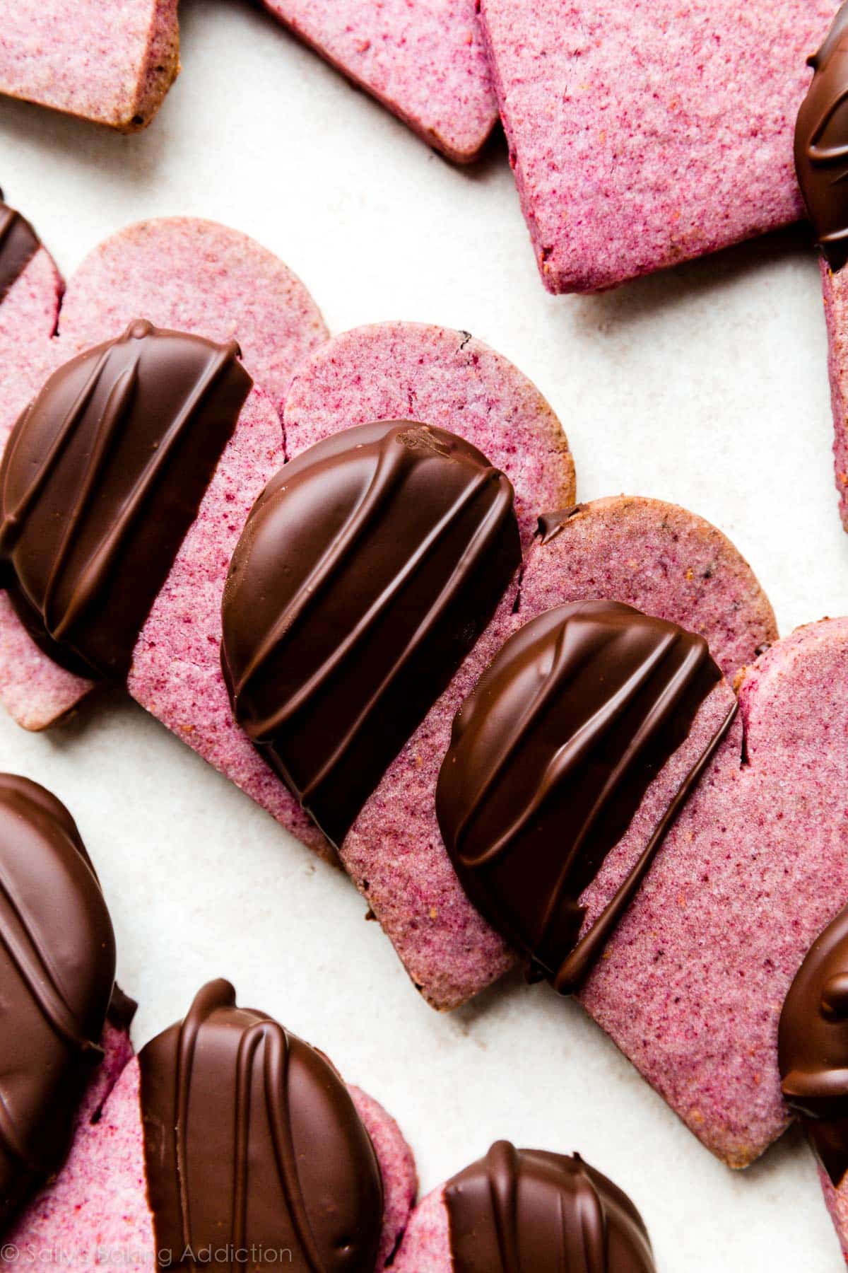 heart shaped raspberry cookies dipped in dark chocolate