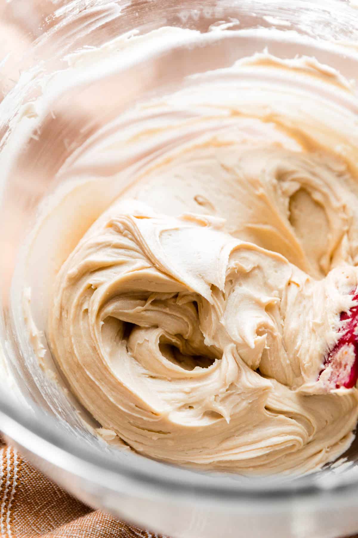 Baileys buttercream frosting in a glass mixing bowl
