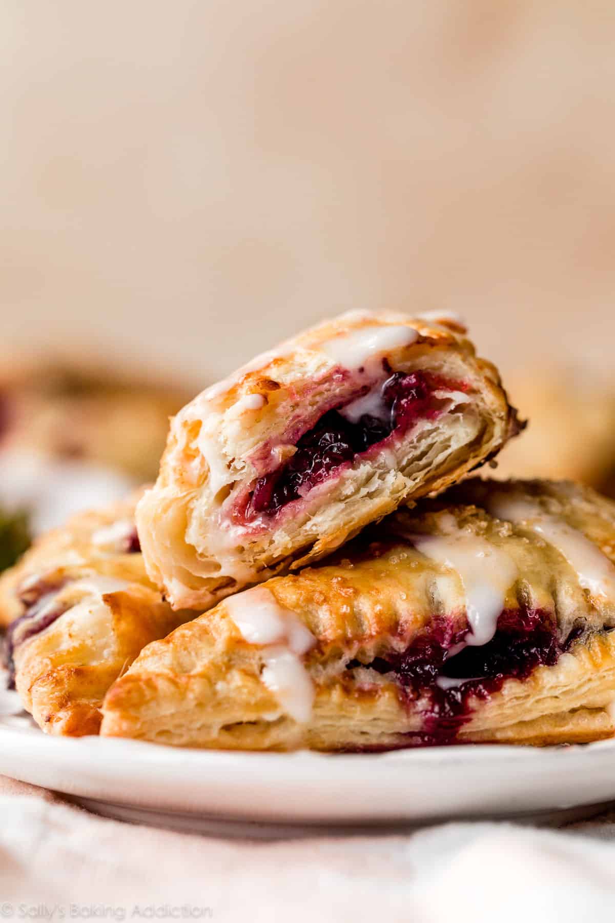 inside of a baked berry turnover showing layers of puff pastry dough