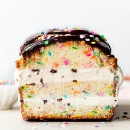 ice cream layered loaf cake with chocolate ganache and sprinkles