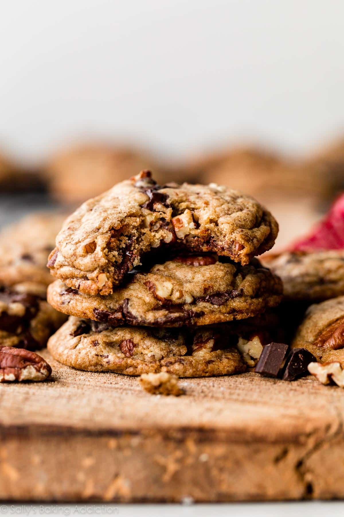 stack of brown butter cookies made with dark chocolate and pecans